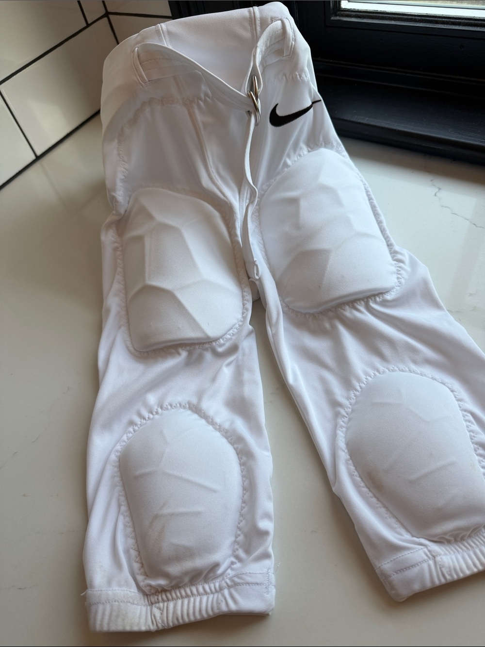 Nike White Kids Padded Football Bottoms with Black Swoosh